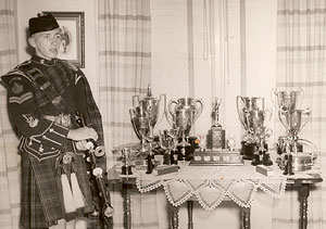 A young Dad with trophies